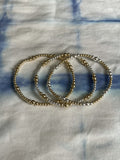 Stack of Alternating Mixed Metal Bracelets